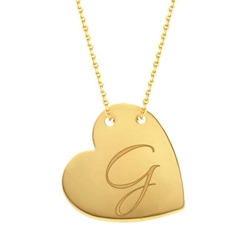 Cursive G traced across a polished solid 14K yellow gold heart pendant