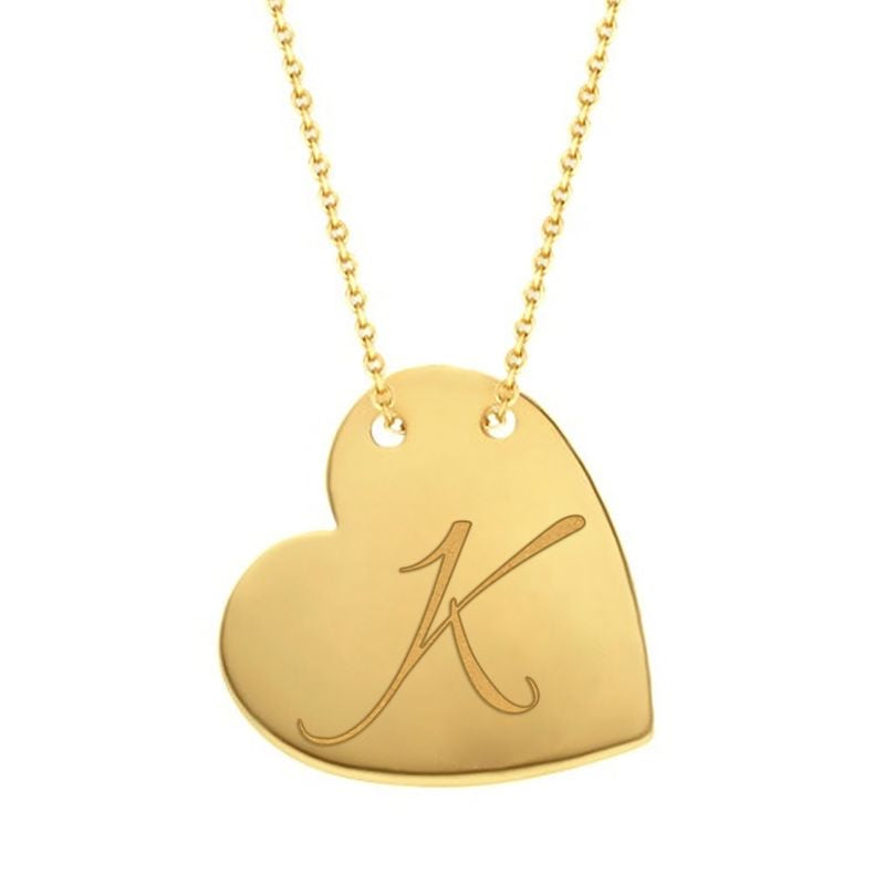 Cursive K traced across a polished solid 14K yellow gold heart pendant