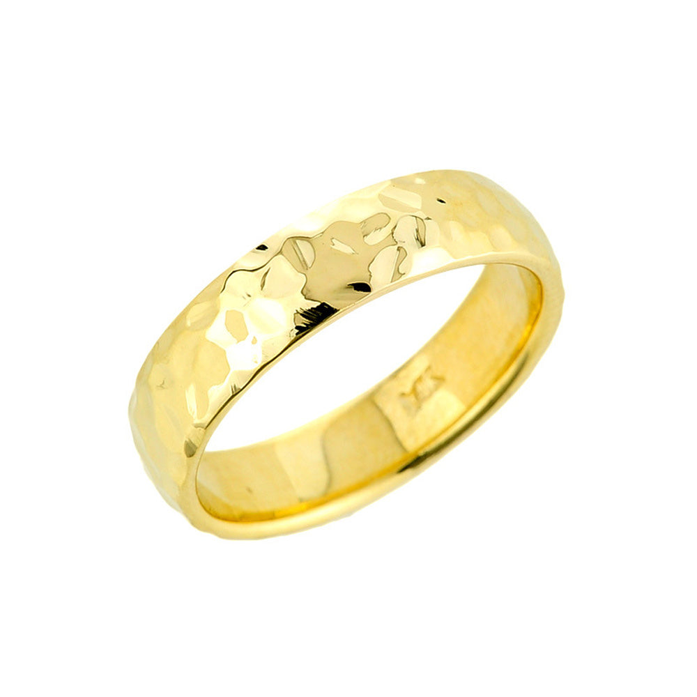 Hammered 5.5 mm comfort-fit band in solid 14K yellow gold with polished edges