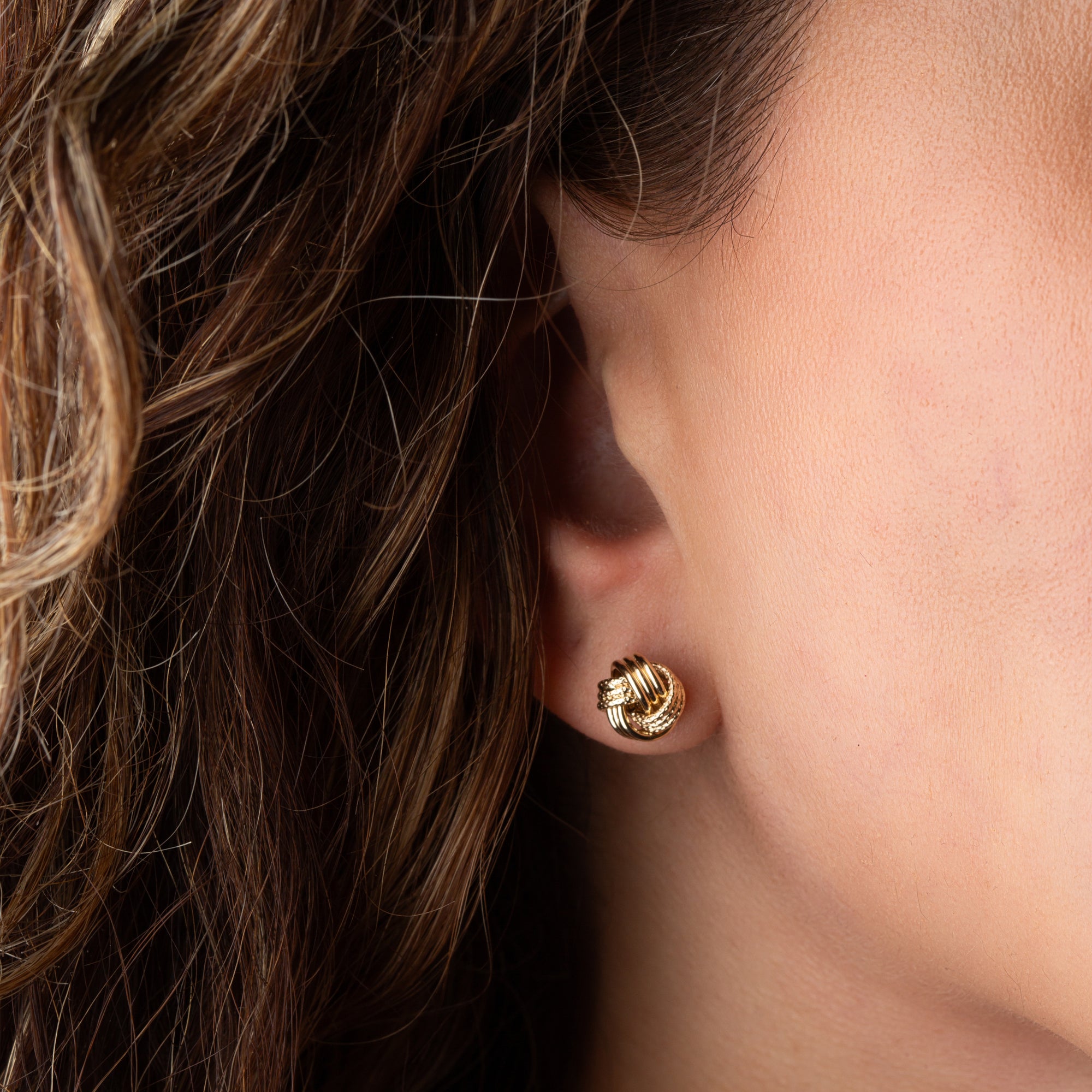 14K Yellow Gold Interlocking Love Knot Textured Stud Earrings, view 2