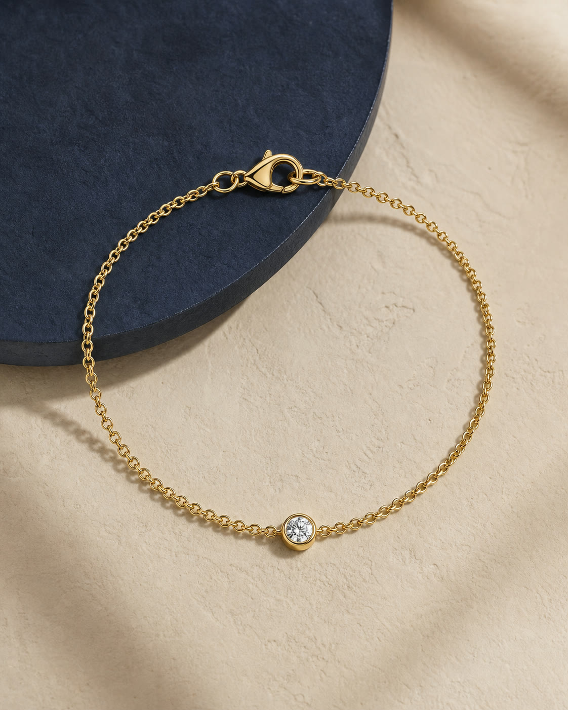 An editorial arrangement of yellow-gold bracelets