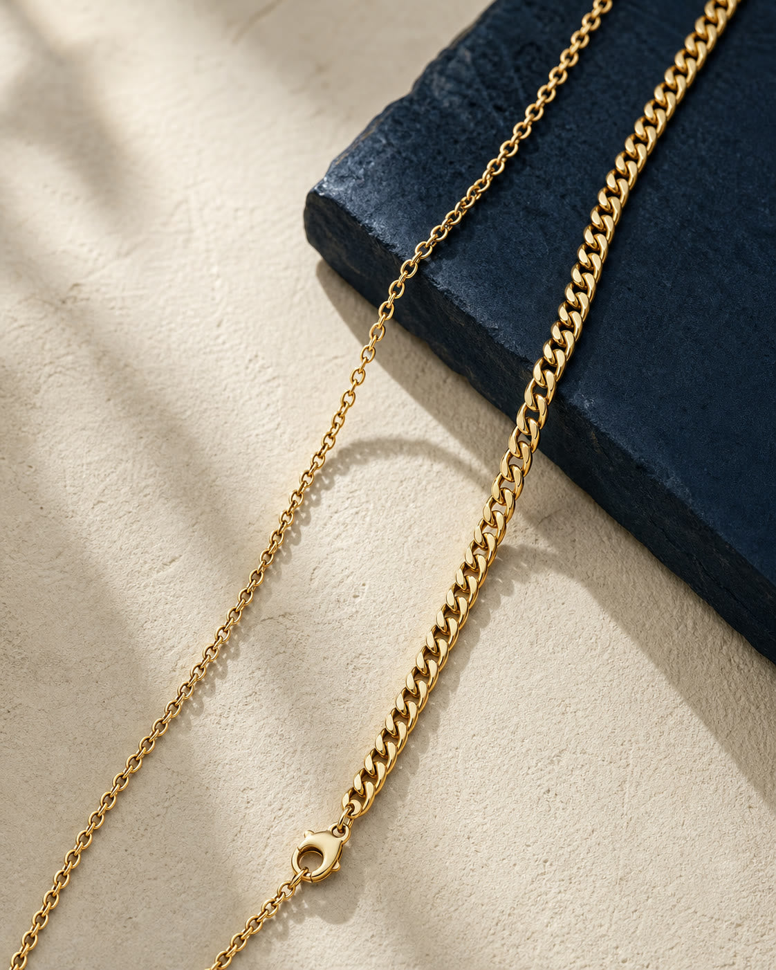 An editorial arrangement of yellow-gold chains
