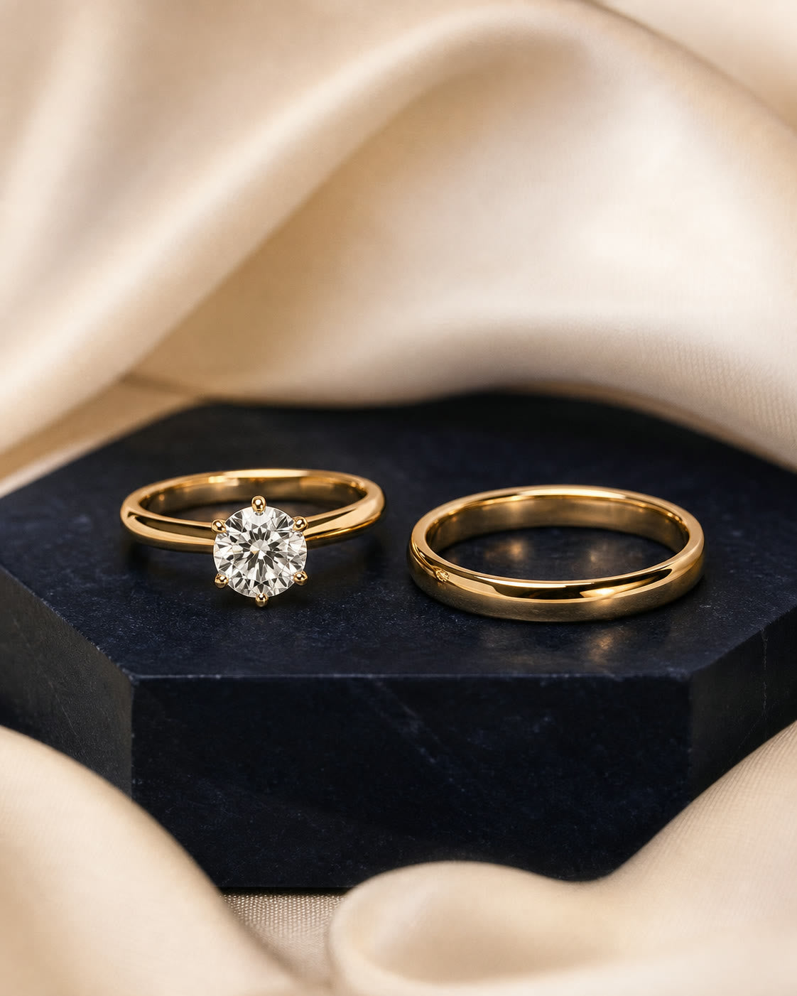 An editorial arrangement of yellow-gold wedding and engagement rings