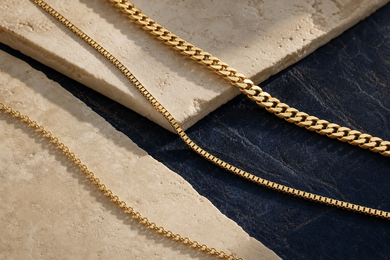 Three yellow-gold chains with fine, box, and curb-style links